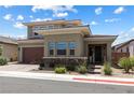 Charming two-story home featuring low-maintenance landscaping and a welcoming front entrance at 417 Honeybrush Ave, Henderson, NV 89011