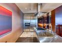 Sleek stainless steel kitchen with modern appliances and marble floors, ready to use at 4381 W Flamingo Rd # 901, Las Vegas, NV 89103