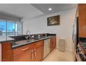 A well-lit kitchen features stainless steel appliances, a sink, and a view of the city skyline at 4525 Dean Martin Dr # 901, Las Vegas, NV 89103