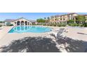 Sparkling community pool with lounge chairs for relaxing poolside at 4559 Dover Straight St, Las Vegas, NV 89115