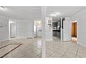 Open-concept living area with tile flooring and neutral paint colors at 5101 Churchill Ave, Las Vegas, NV 89107