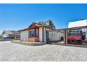 This home's gated side yard, constructed of pavers, provides extra secure parking at 5876 Tippin Dr, Las Vegas, NV 89130