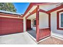Inviting covered front porch leads to the front door of the quaint single-story house at 5876 Tippin Dr, Las Vegas, NV 89130