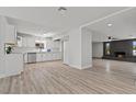 Bright kitchen boasts white cabinetry, stainless steel appliances, and open layout to living area at 6229 Cromwell Ave, Las Vegas, NV 89107