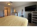 Spacious main bedroom with a large bed, wall-mounted TV, and walk-in closet at 6700 Oak Valley Dr, Las Vegas, NV 89103