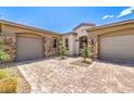 Elegant home featuring a brick driveway and a two-car garage at 7111 Bath Dr, Las Vegas, NV 89131
