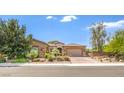 Attractive single-story home featuring desert landscaping and a brick-paved driveway at 7111 Bath Dr, Las Vegas, NV 89131
