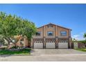 Charming two-story home with three-car garage, a lush tree, and front lawn at 7761 Cowboy Trl, Las Vegas, NV 89131