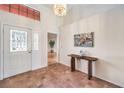 Welcoming foyer with tile floors, high ceilings, and stylish decor at 8428 Apple Hill Ct, Las Vegas, NV 89128