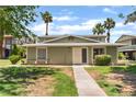 Attractive exterior showcasing a well-manicured lawn, walkway to the front door and desert landscaping at 1470 Elizabeth Ave # 1, Las Vegas, NV 89119
