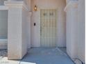 Inviting entryway with a secure screen door and a neutral color scheme at 1551 Echo Falls Ave, Las Vegas, NV 89183