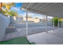 Spacious backyard featuring a covered patio area with a block wall surround at 1728 S Christy Ln, Las Vegas, NV 89142