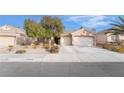 Charming single-story home featuring a well-manicured front yard and a two-car garage at 2144 Paganini Ave, Henderson, NV 89052