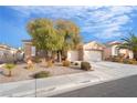 Inviting single-story home with a desert-landscaped front yard and a convenient two-car garage at 2144 Paganini Ave, Henderson, NV 89052