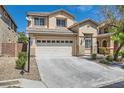 Inviting two-story home with a well-manicured lawn, a driveway, and an attached garage at 216 Sharp Edge Ave, North Las Vegas, NV 89031