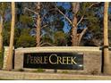 Pebble Creek community sign with trees, landscaping, and stone features creating an attractive neighborhood entrance at 2419 Pebble Springs Ct, Henderson, NV 89074