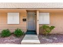 Inviting home front entrance with security door and desert landscaping at 2569 Paradise Village Way, Las Vegas, NV 89120