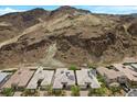 Stunning aerial view showcases houses nestled against the backdrop of picturesque mountains at 26 Costa Tropical Dr, Henderson, NV 89011
