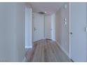 Hallway featuring wood floors, neutral walls, and multiple access doors for easy navigation at 2747 Paradise Rd # 2305, Las Vegas, NV 89109