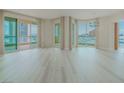 Bright living room with wood floors and large windows offering city views at 2747 Paradise Rd # 2305, Las Vegas, NV 89109