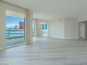 Spacious living room with hardwood floors and floor to ceiling windows at 2747 Paradise Rd # 2305, Las Vegas, NV 89109