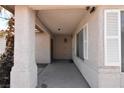 Covered entryway featuring exterior lighting and shutters on windows at 2839 Kensington St, Las Vegas, NV 89156