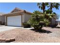 Inviting single-story home with a two-car garage, neutral paint, and low-maintenance landscaping at 2839 Kensington St, Las Vegas, NV 89156