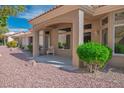 Relaxing back patio with shaded seating area and well-maintained desert landscaping at 2913 Laverton Dr, Las Vegas, NV 89134