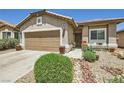 Lovely single-story home featuring desert landscaping, an attached garage and front patio seating area at 3642 Winter Whitetail St, Las Vegas, NV 89122