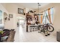 Open-concept area featuring a workstation, dining area, and exercise equipment at 3642 Winter Whitetail St, Las Vegas, NV 89122