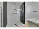 Modern bathroom with a glass-enclosed shower and elegant tile work at 3986 Belleville Ave, Las Vegas, NV 89121