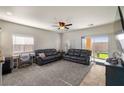 Bright and airy living room with sliding glass doors to the backyard and comfortable seating at 4780 Lorenzo Way, Pahrump, NV 89061