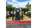Community entrance area with desert landscaping, offering a serene and stylish welcome at 4805 S Torrey Pines Dr # 101, Las Vegas, NV 89103