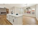 Bright kitchen featuring an island with white countertops and stainless steel appliances at 6388 Canyon Dawn Ave, Las Vegas, NV 89108