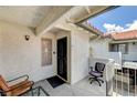 Private patio area featuring tiled flooring, a small table and comfortable seating at 6735 W Charleston Blvd # 4, Las Vegas, NV 89146