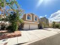 Beautiful two-story home with a spacious driveway, a two-car garage, and lush landscaping, a great Gathering residence at 8125 Rio De Janeiro Dr, Las Vegas, NV 89128