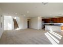 Bright, open-concept living area flows seamlessly to the kitchen and stairway, filled with natural light at 89 Via Franello, Henderson, NV 89011
