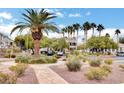 Lush landscaping surrounds the building, featuring palm trees and well-maintained shrubs at 3322 Dragon Fly St, North Las Vegas, NV 89032
