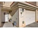 Charming home exterior featuring a well-maintained front entrance, garage, and street number at 3322 Dragon Fly St, North Las Vegas, NV 89032