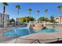 A beautifully maintained community pool with lush landscaping, perfect for relaxation at 3322 Dragon Fly St, North Las Vegas, NV 89032