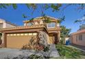 Charming two-story home featuring a large two-car garage and tile roof at 3412 Adventure Ct, Las Vegas, NV 89129