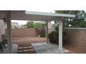 Enclosed backyard featuring a covered patio and mature landscaping, perfect for outdoor entertaining at 3416 Mountain Park St, Las Vegas, NV 89129
