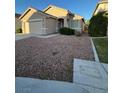 Charming single-story house with gravel landscaping, and a covered entrance, offering easy maintenance and curb appeal at 3416 Mountain Park St, Las Vegas, NV 89129