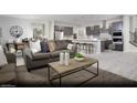 Open-concept living room with comfortable seating, stylish decor, and seamless flow to kitchen at 390 Arizona St # Lot 9, Boulder City, NV 89005