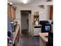 Basic kitchen with wooden cabinets and essential appliances at 4931 Nevada Ave, Las Vegas, NV 89104