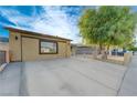 Spacious driveway, partially gated, in front of a charming single-story home at 520 Prince Alan Ct, Las Vegas, NV 89110