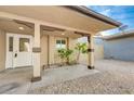 Inviting covered front porch with decorative support columns and stone landscaping at 520 Prince Alan Ct, Las Vegas, NV 89110