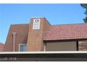 Exterior shot of condo building showcasing unit numbers and roof style at 5383 Indian River Dr # 327, Las Vegas, NV 89103