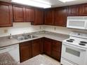 Well-maintained kitchen with granite-style counters and modern white appliances at 5383 Indian River Dr # 327, Las Vegas, NV 89103