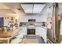 Bright kitchen featuring white cabinets and stainless steel appliances at 5706 W Lake Mead Blvd, Las Vegas, NV 89108